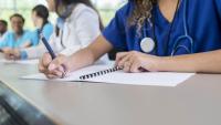 Medical student taking notes